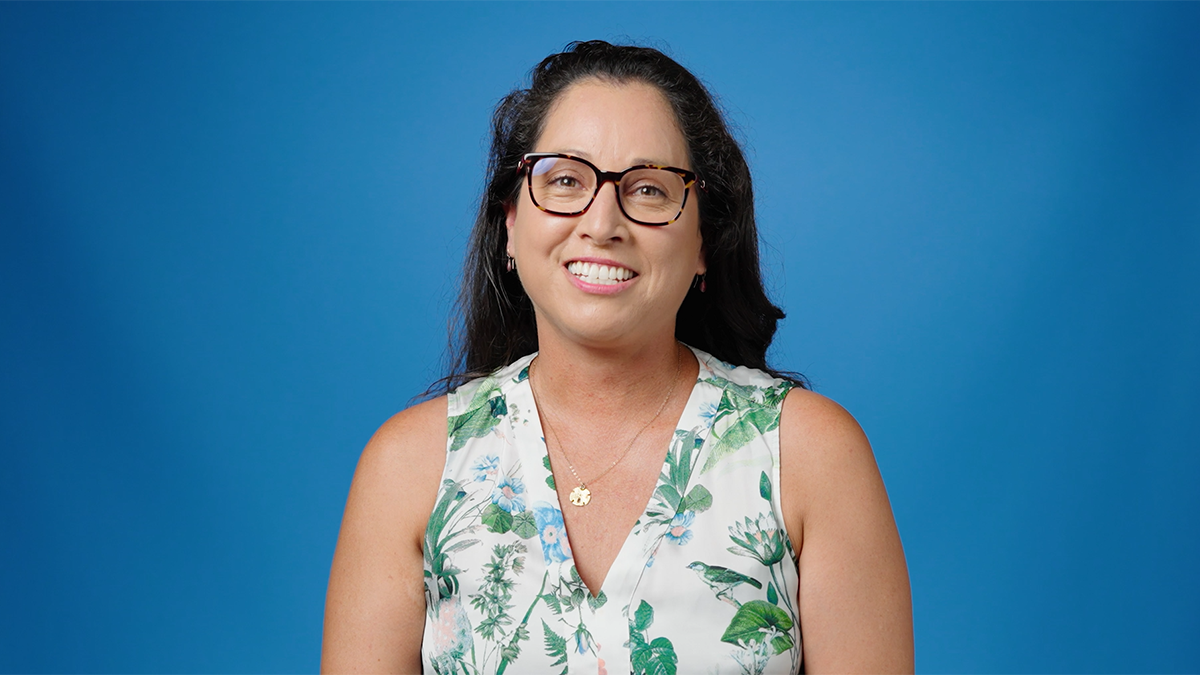 Portrait image of Maria Christina Vasquez on blue background